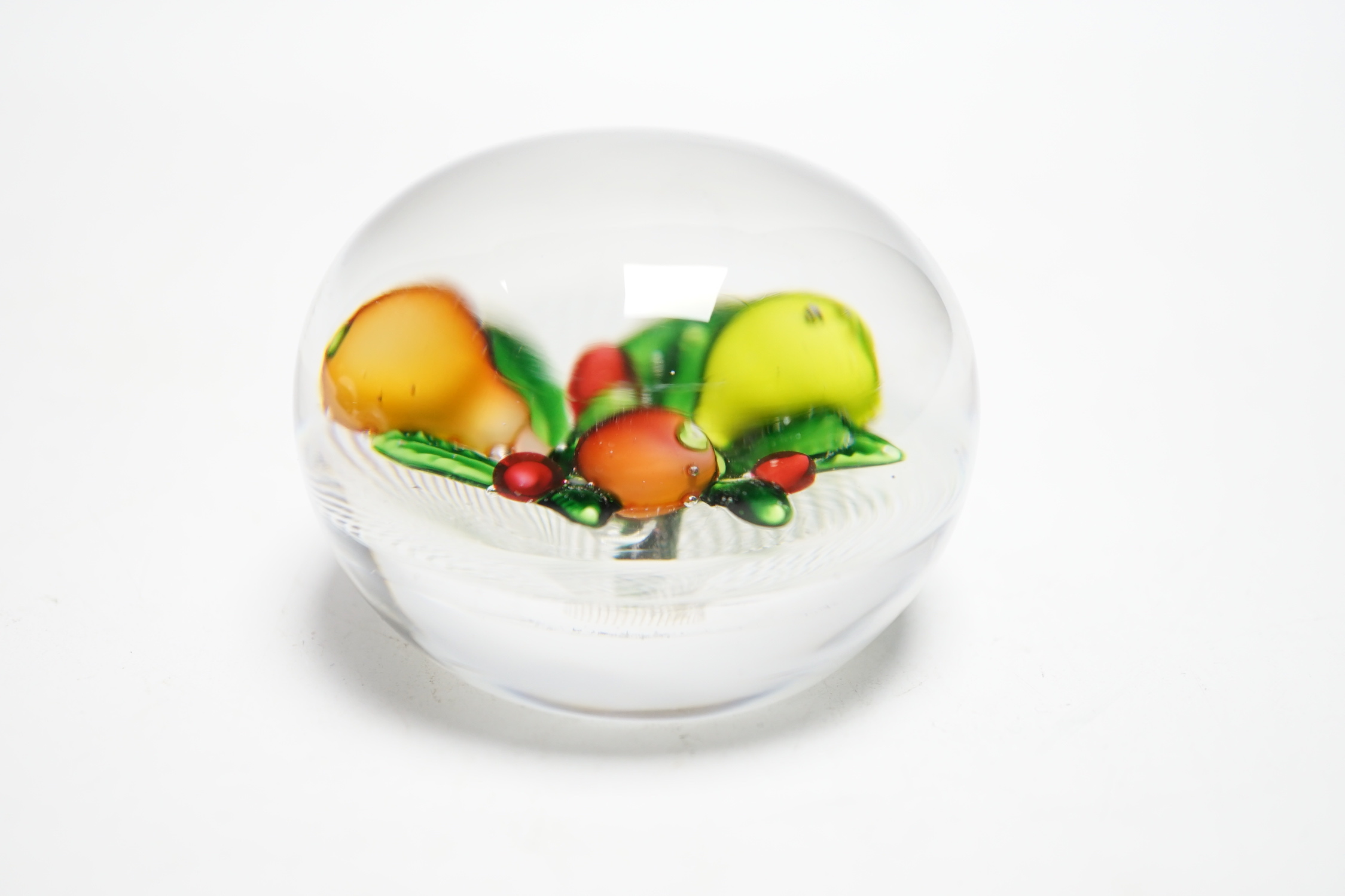 A St Louis fruit paperweight, on a latticino ground, 6.3cm